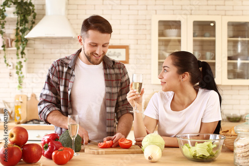 Lovely young couple cooking...