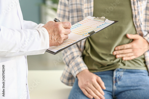 Urologist with clipboard an...