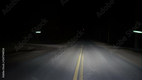 Driving twisting turning rural highway in pitch black night timelapseRunning from the law driving down a dark country highway, twisting and turning left and right. The night is dark and the road is lo