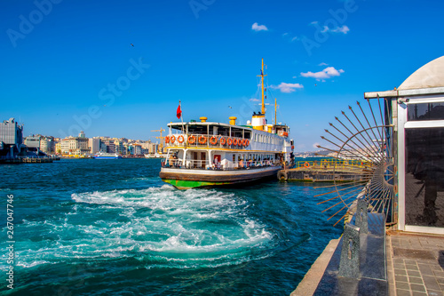 Wallpaper Mural Muslim architecture and water transport in Turkey - Beautiful View touristic landmarks from sea voyage on Bosphorus. Cityscape of Istanbul at sunset - old mosque and turkish steamboats, view on Golden Torontodigital.ca