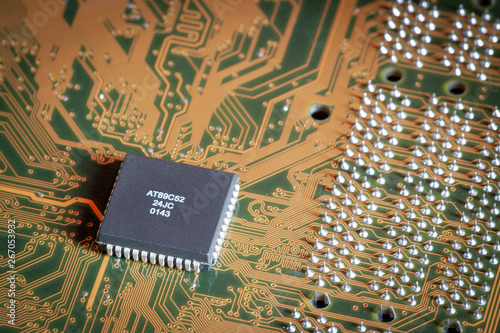 Square grey microchip on motherboard close up. photo