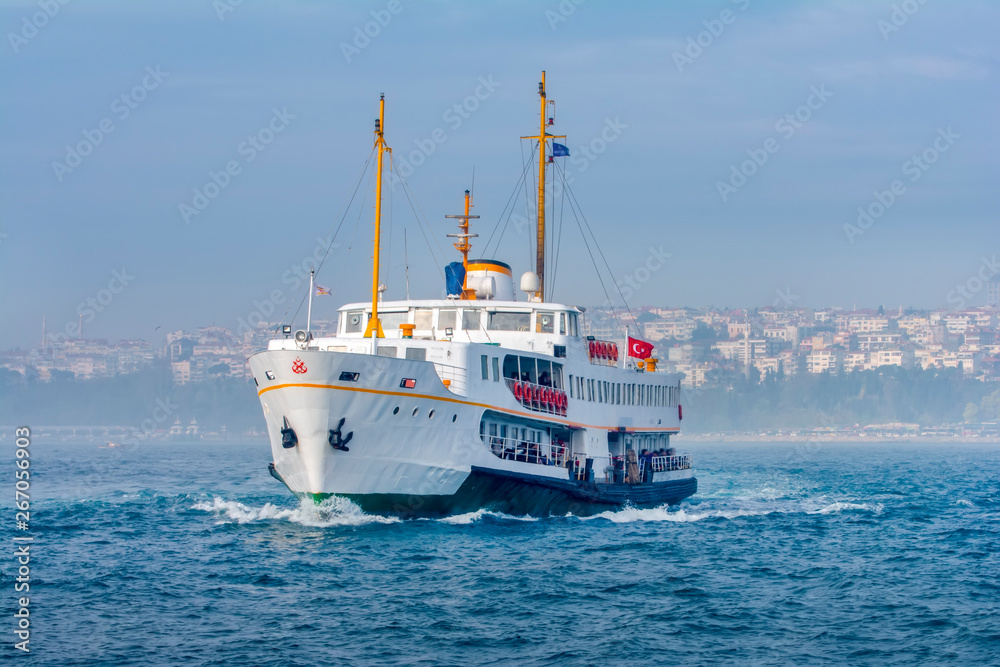 Muslim architecture and water transport in Turkey - Beautiful View touristic landmarks from sea voyage on Bosphorus. Cityscape of Istanbul at sunset - old mosque and turkish steamboats, view on Golden Muslim architecture and water transport in Turkey - Beautiful View touristic landmarks from sea voyage on Bosphorus. Cityscape of Istanbul at sunset - old mosque and turkish steamboats, view on Golden