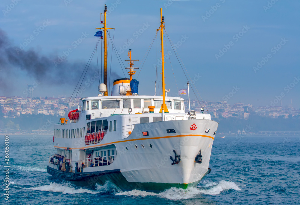 Muslim architecture and water transport in Turkey - Beautiful View touristic landmarks from sea voyage on Bosphorus. Cityscape of Istanbul at sunset - old mosque and turkish steamboats, view on Golden Muslim architecture and water transport in Turkey - Beautiful View touristic landmarks from sea voyage on Bosphorus. Cityscape of Istanbul at sunset - old mosque and turkish steamboats, view on Golden