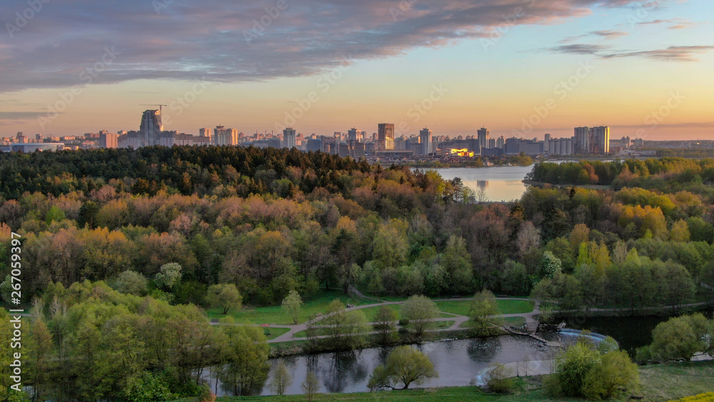 Panoramic view of Minsk city, Belarus. Park of green trees in the foreground