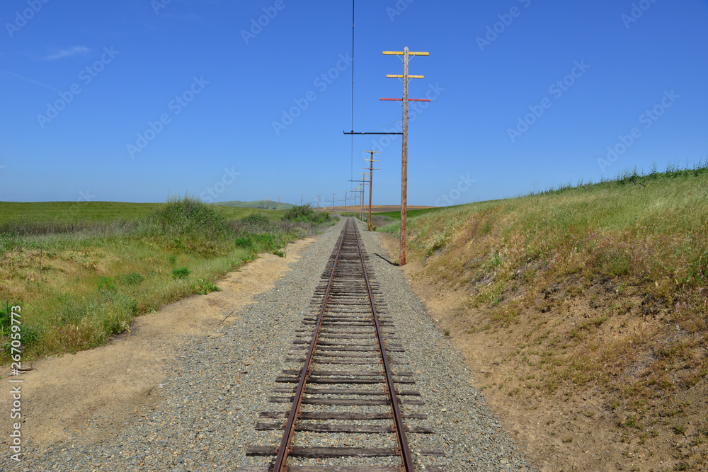 Looking down the Railroad track from an Electric locomotive in California.
