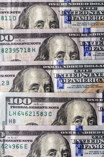 100 dollar bill, the gaze of Benjamin Franklin, vertical location close-up photo