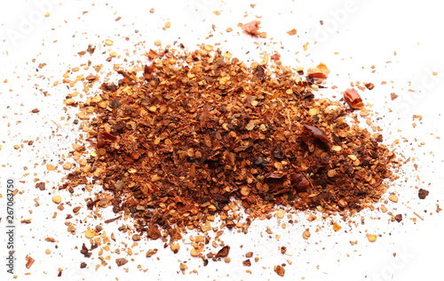 Crushed, ground dry pepper, spicy chopped paprika isolated on white background