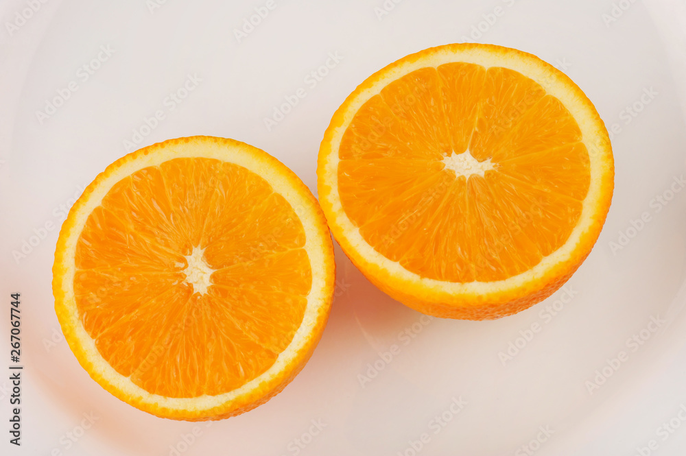 Fresh slised oranges isolated on the gray background