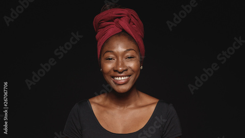 Portrait of smiling african woman in a headwrap