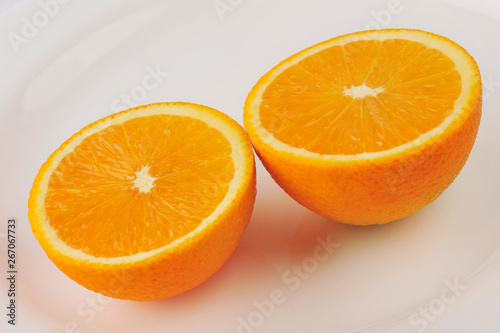 Fresh slised oranges isolated on the gray background