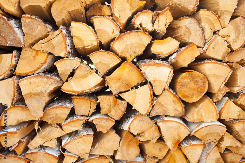 Woodpile of birch firewood. Preparation of wood for the oven. wood background. Preparation for winter Woodpile of birch firewood. Preparation of wood for the oven. wood background. Preparation for winter