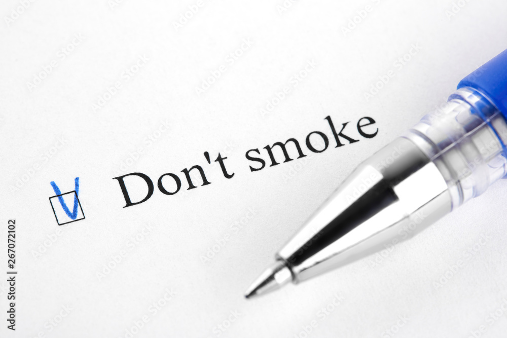 Don't smoke. Filling in the questionnaire, documents. The checkboxes are filled with a black pen on a white background. Questionnaire, survey. Don't smoke. Filling in the questionnaire, documents. The checkboxes are filled with a black pen on a white background. Questionnaire, survey.