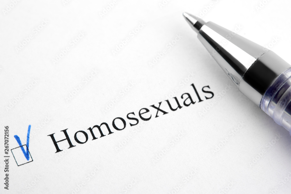Homosexuals. Filling in the questionnaire, documents. The checkboxes are filled with a black pen on a white background. Questionnaire, survey. Homosexuals. Filling in the questionnaire, documents. The checkboxes are filled with a black pen on a white background. Questionnaire, survey.