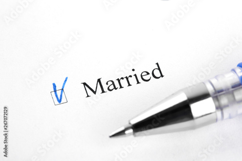 Married. Filling in the questionnaire, documents. The checkboxes are filled with a black pen on a white background. Questionnaire, survey.