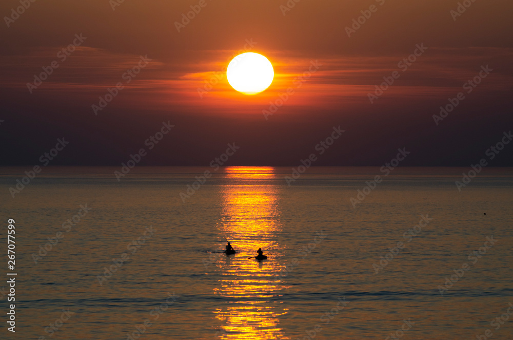 surfer sunset over the sea