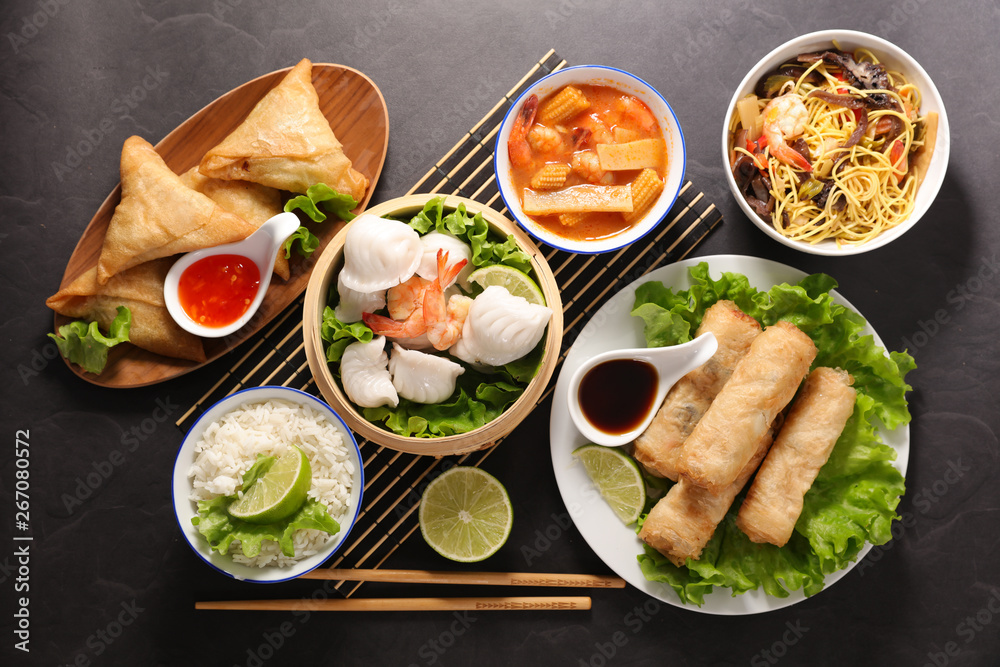 selection of asian meal with spring roll, samosa, fried noodles, soup