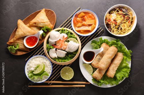 selection of asian meal with spring roll, samosa, fried noodles, soup