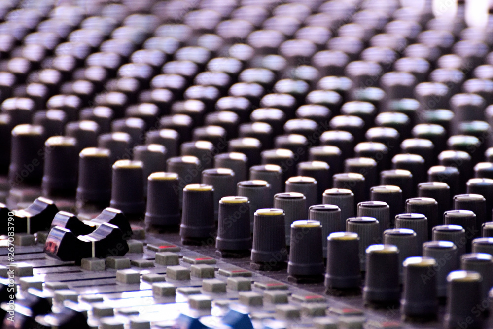 Fototapeta premium Close-up of sound mixer in a studio mixing sound.