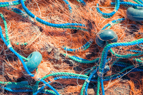Valokuva Crumpled fishnet with buoys on rope. Nautical marine background.