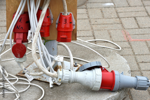 Electrical extension cord with plugs