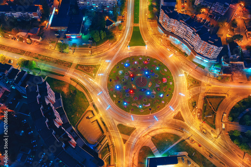 Top view of Road roundabout. Cityscape downtown at night