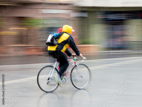 Cyclist on the city roadway in motion blur
