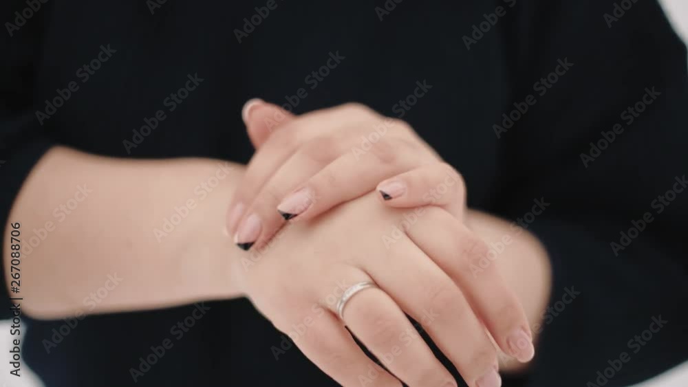 hands of a girl close-up in the unfocus hands of a girl close-up in the unfocus