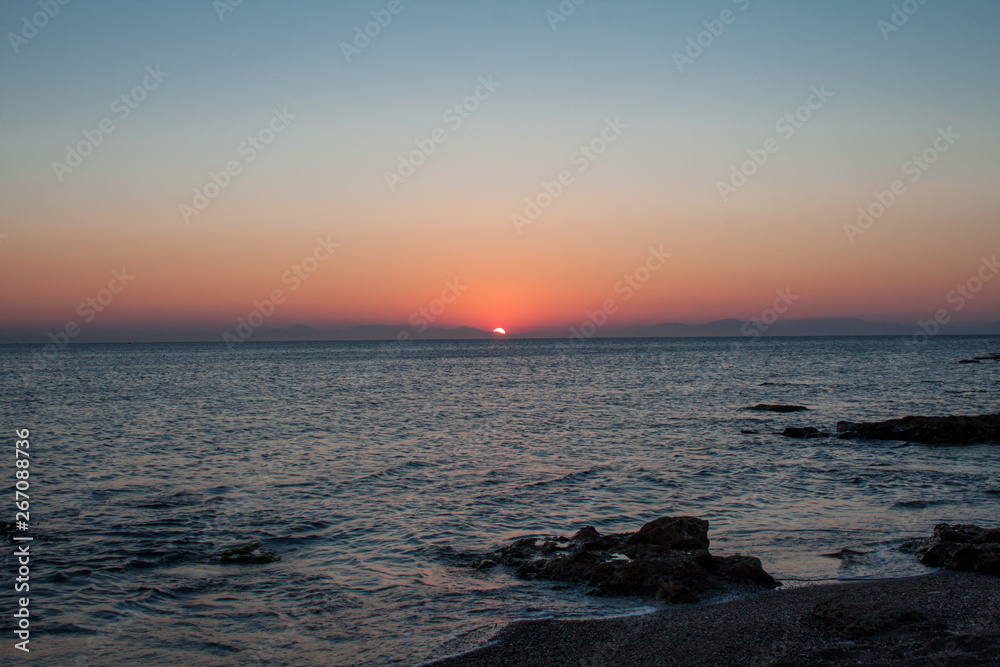 sunrise at Rhodes harbor in Greece