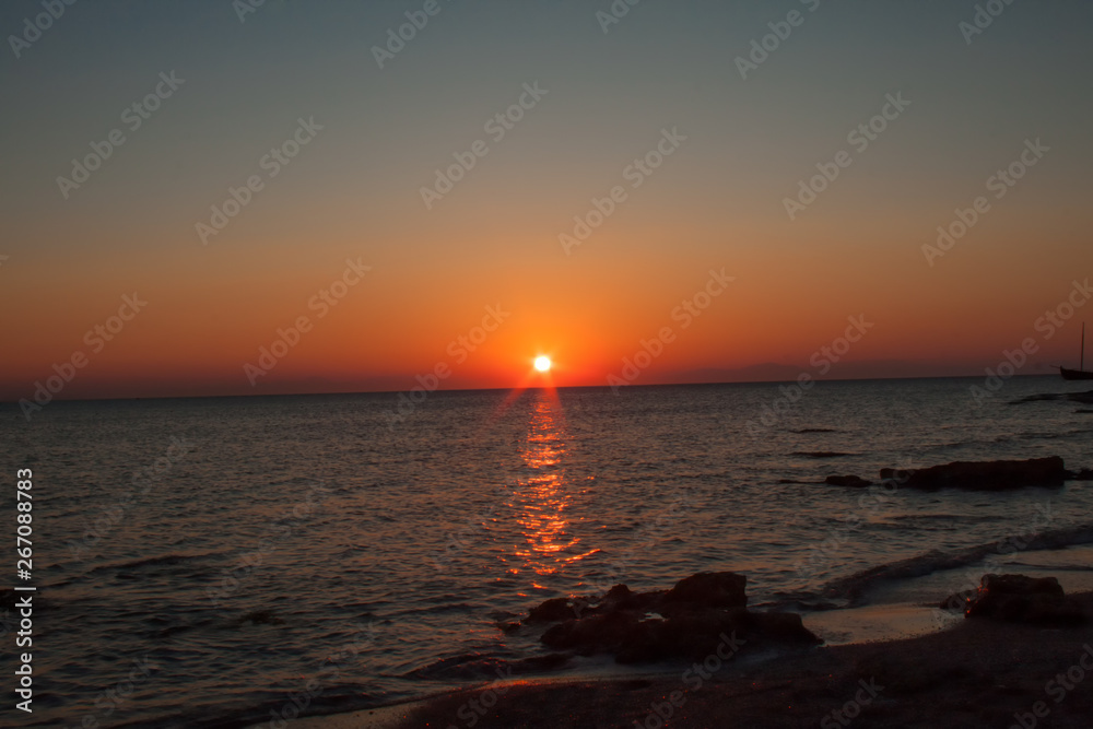 sunrise at Rhodes harbor in Greece sunrise at Rhodes harbor in Greece