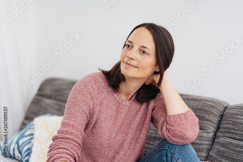 Attractive calm woman sitting watching
