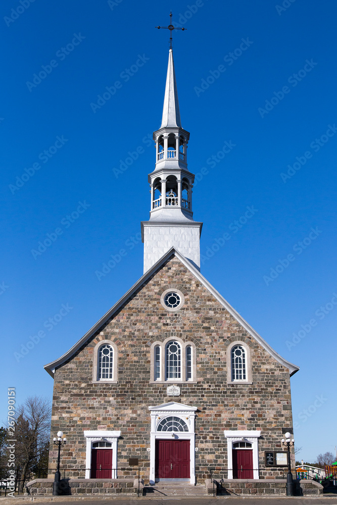 Pretty 1845 patrimonial fieldstone catholic village church, Cacouna, Quebec, Canada