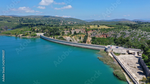 Aerial drone photo of famous lake and dam of Marathon or Marathonas with beautiful clouds and blue sky, North Attica, Greece