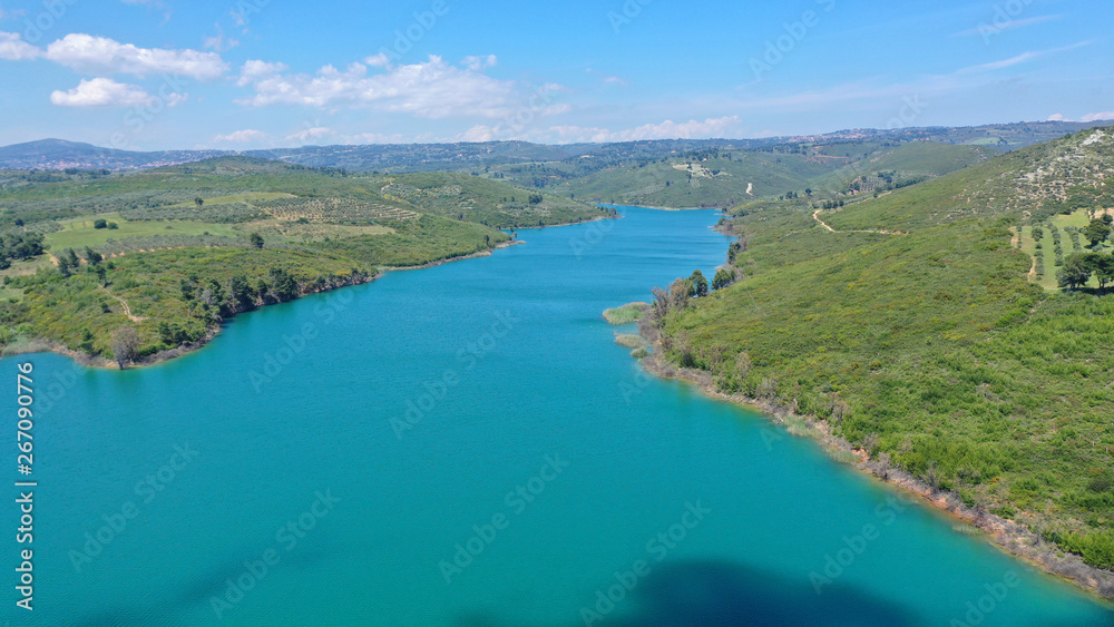 Aerial drone photo of famous lake and dam of Marathon or Marathonas with beautiful clouds and blue sky, North Attica, Greece