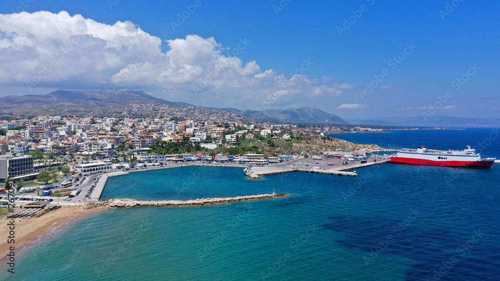 Aerial drone bird's eye panoramic view of famous port and city of Rafina with passenger ferries travel to Aegean islands, Attica, Greece