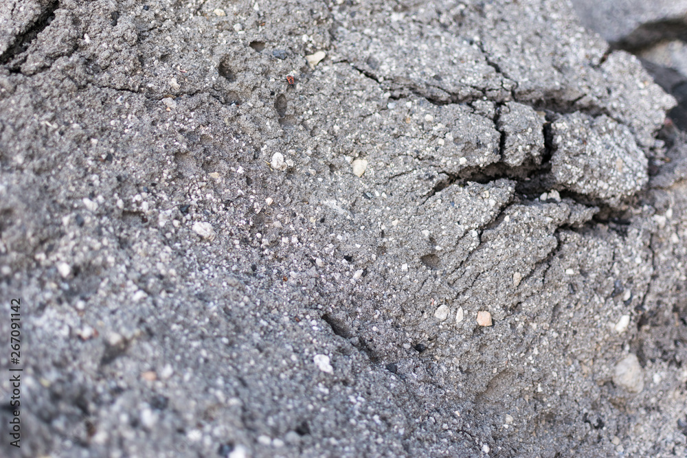 Old asphalt with cracks. The texture of the damaged pavement. Old asphalt with cracks. The texture of the damaged pavement.