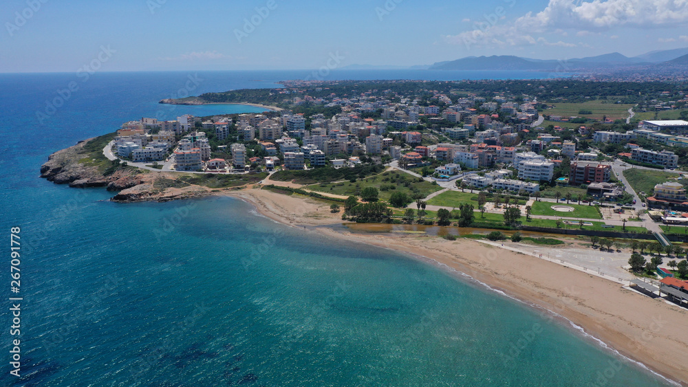 Aerial drone bird's eye panoramic view of famous port and city of Rafina with passenger ferries travel to Aegean islands, Attica, Greece