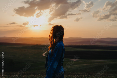 Girl on look at the summer sunset on vacation © Yuliya Timofeeva