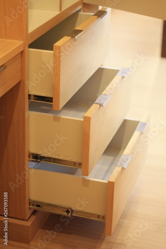 Open the modern cabinet drawer in furniture shop