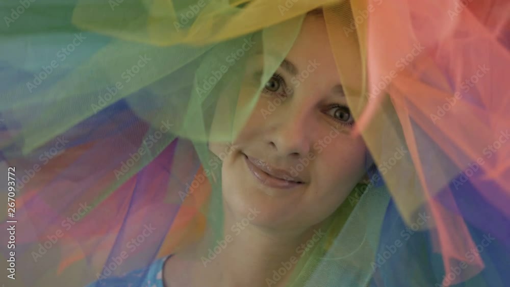 Indoors portrait of amazing caucasian female model in trendy colorful wig woman with hair having fun smiling and dancing . Indoors portrait of amazing caucasian female model in trendy colorful wig woman with hair having fun smiling and dancing .