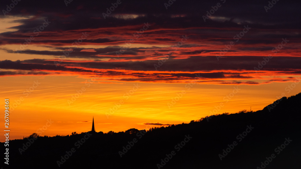 Church panorama silhouette at sunset in countyside