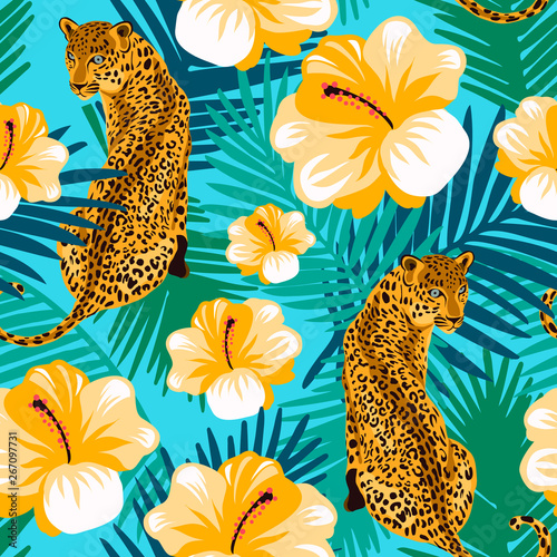 Floral jungle leopard seamless pattern. Animal print pattern with tropical leaves and flowers in turquoise background.