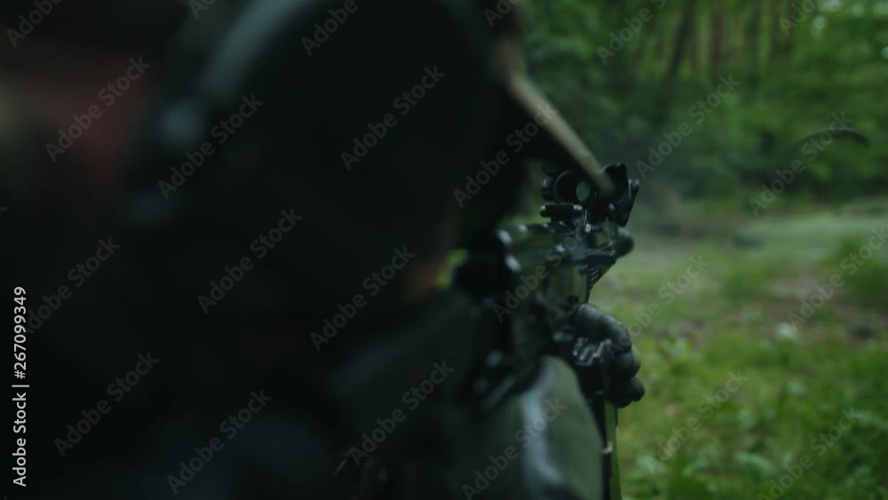 The soldier shoots at the target. Military mission. The soldier shoots at the target. Military mission.