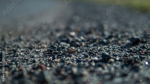 Close up on gravel on a gravel road in the summertime