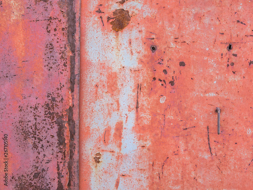 Old paint on metal surface, rust stains.