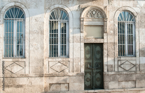 Old retro weathered vintage neglected house stone slabs facade