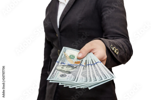 Female hands hold dollars on white background. Close-up.