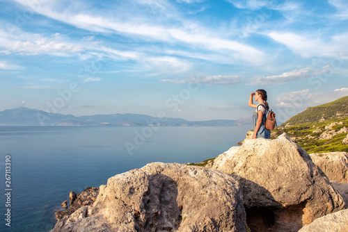 Young beautiful girl traveling along the coast of the Mediterranean Sea.