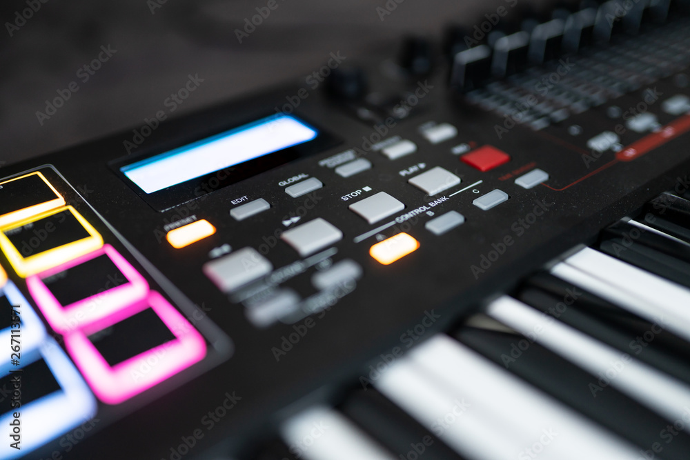 Keyboard / electronical piano for recording music in a studio: media and recording controls Keyboard / electronical piano for recording music in a studio: media and recording controls