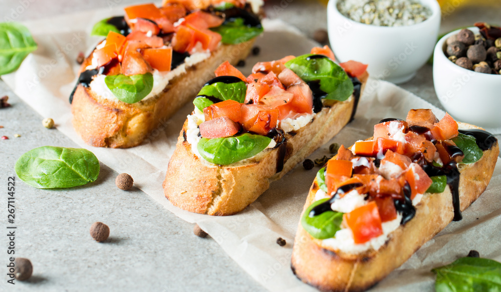 Tomato and cheese fresh made bruschetta. Italian tapas, antipasti with vegetables, herbs and oil on grilled ciabatta and baguette bread. Sandwich. Tomato and cheese fresh made bruschetta. Italian tapas, antipasti with vegetables, herbs and oil on grilled ciabatta and baguette bread. Sandwich.