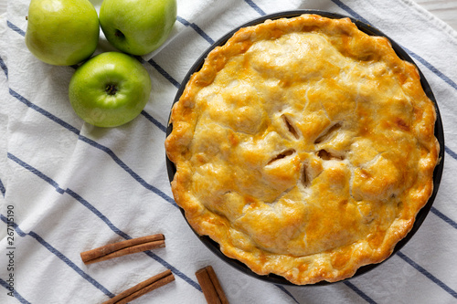 Homemade apple pie on cloth, top view. Flat lay, overhead, from above. photo